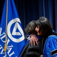 Samhita and President hug on stage